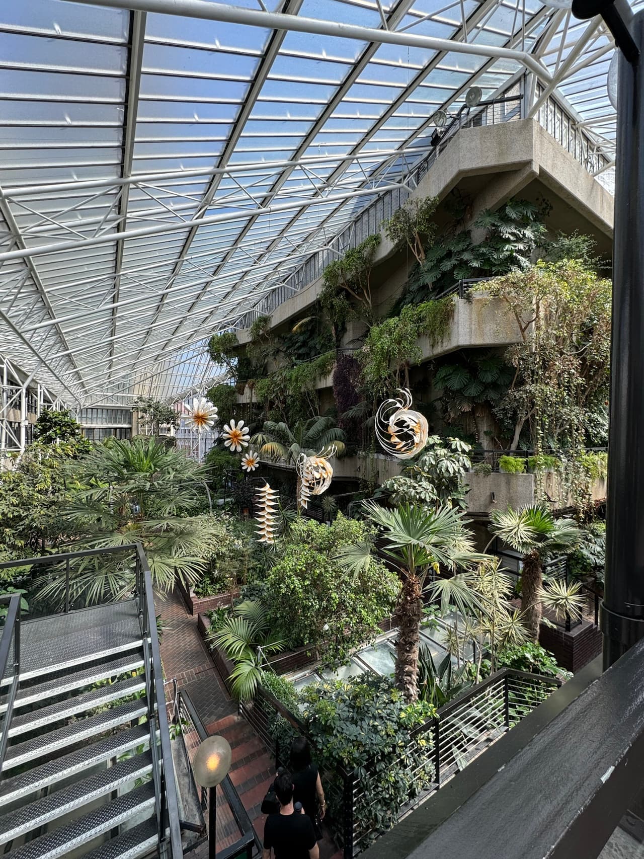 Dense, lush greenery fills the Barbican’s iconic indoor garden